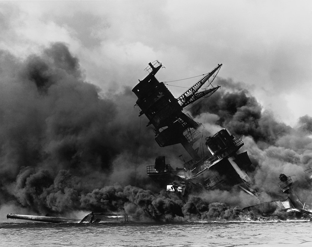 The_USS_Arizona_(BB-39)_burning_after_the_Japanese_attack_on_Pearl_Harbor_-_NARA_195617_-_Edit.jpg